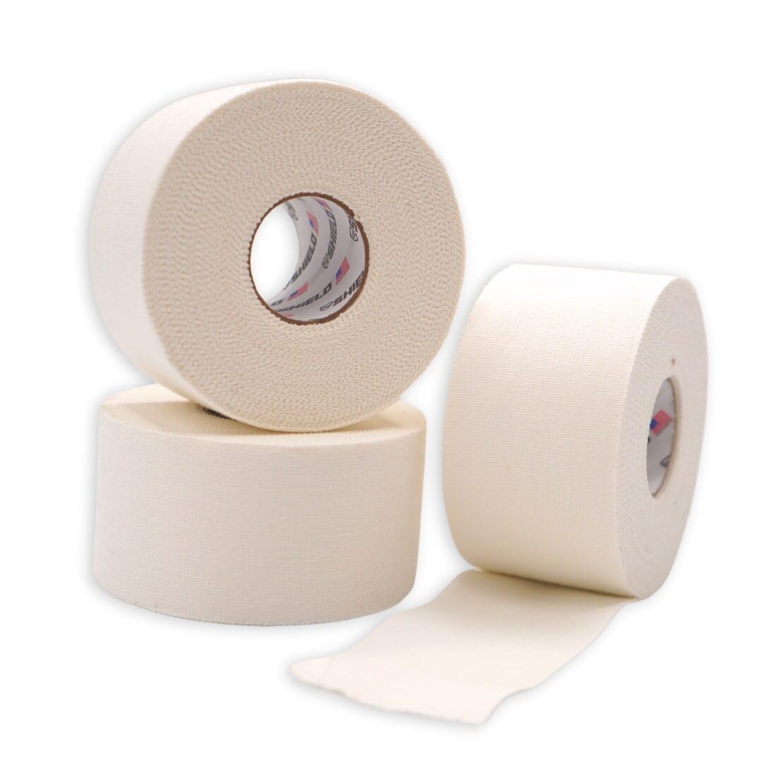 SHIELD | 32 Pack White Athletic Tape Bulk- 1.5 Inches x 15 Yards - Made in USA Easy Tear, Rigid, No Residue. Sports Medicine - Athletes, Medical, Therapy, Athletic Trainers: Ankles Wrists Fingers