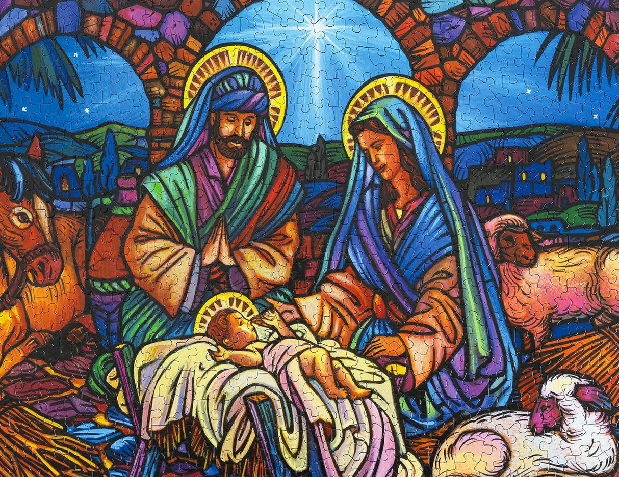 Springbok's Stained Glass Nativity 500 Piece Jigsaw Puzzle Features a Mosaic Interpretation of The Nativity by Artist Lew Johnson